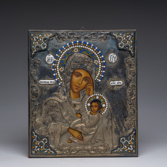 A Russian orthodox 'Mother of God' icon with partly enamelled silver-plated brass oklad or riza, 20th C.