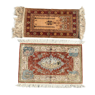 Two Turkish Hereke silk rugs with animals and floral design, 20th C.