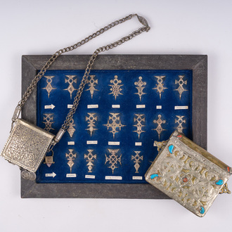 21 silver Tuareg pendants and two Koran boxes in silver and copper, Nigeria, Mali and Morocco, 19th/20th C.