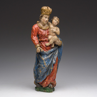 A Flemish polychromed wooden sculpture of The Madonna with Child, 18th C.