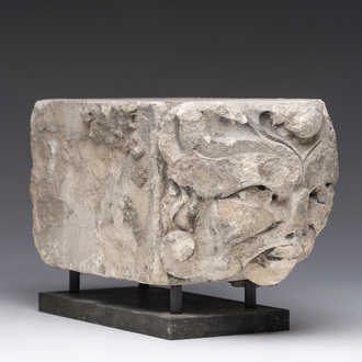 A Romanesque carved stone corbel with a grotesque head, probably France, 14th/15th C.