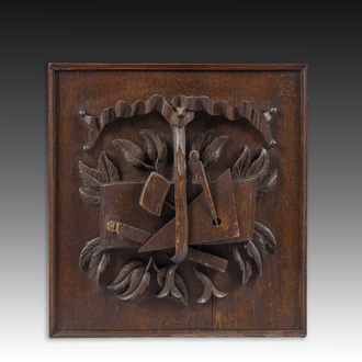 A Belgian carved wooden mason's panel with building tools, first half 20th C.