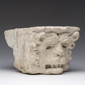 An architectural limestone fragment with a lion's head, probably 16th C.