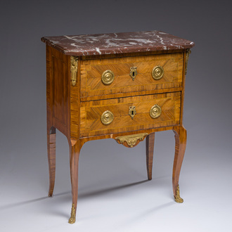 Jacques-Pierre Letellier (ca.1745-?): A mahogany veneer Louis XVI chest of drawers with gilt bronze mounts and red marble top