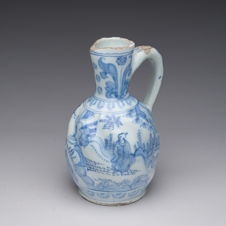A twisted blue and white Dutch Delft chinoiserie jug, 17th C.