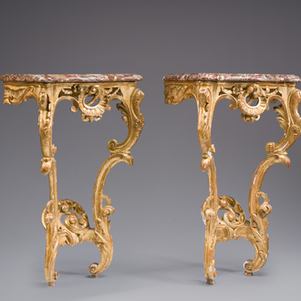 A pair of French carved gilt wooden Louis XV consoles with marble tops, 18th C.