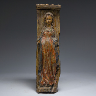 A Flemish polychromed wooden relief with a female saint, 16th/17th C.