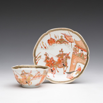 Een Chinese ijzerrode en vergulde 'Sanguozhi yanyi' kop en schotel, Yongzheng