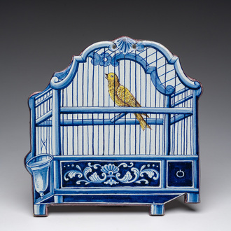 A polychrome Delftware birdcage plaque, Tichelaar, Makkum, Friesland, 19th C.