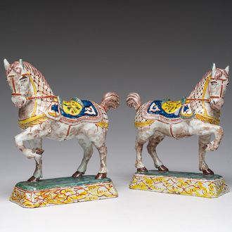 A pair of polychrome Dutch Delftware models of horses, 19th C.