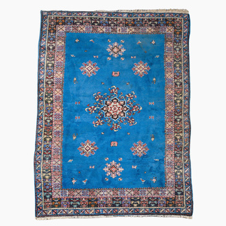 A presumably Tunisian rug with a central medallion, wool on cotton, 20th C.