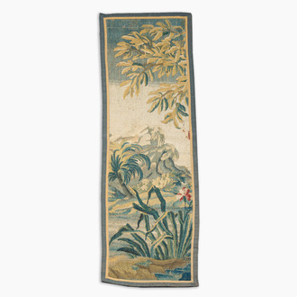 A fragment of a Flemish wall tapestry with a landscape, 17th C.
