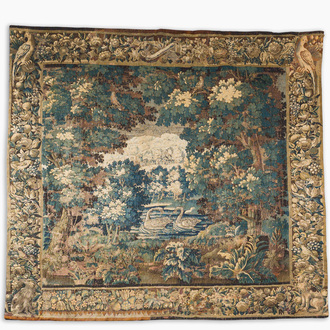 A Flemish verdure wall tapestry with two swans in a lake, probably Oudenaarde, late 17th C.