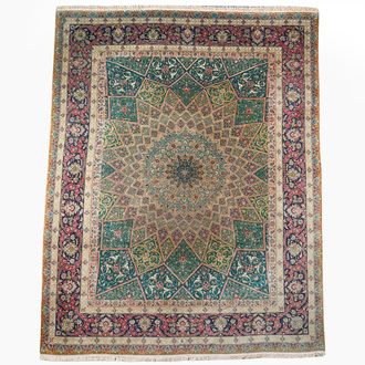 A Persian Tabriz rug with floral design, wool on cotton, first half 20th C.