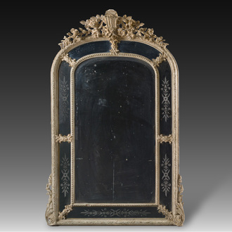 A patinated plaster and etched glass mirror with floral design, 20th C.