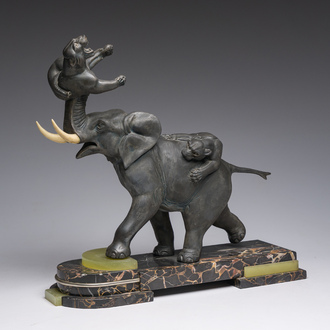 Illegibly signed: An elephant attacked by two tigers, zamak on a marble and onyx base, second quarter 20th C.