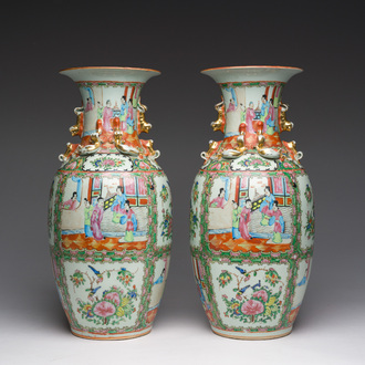 A pair of Chinese Canton famille rose vases with palace scenes and floral design, ca. 1900