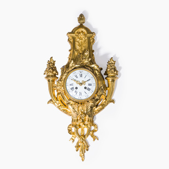 A French gilt bronze Louis XVI style cartel clock with floral design, late 19th C.