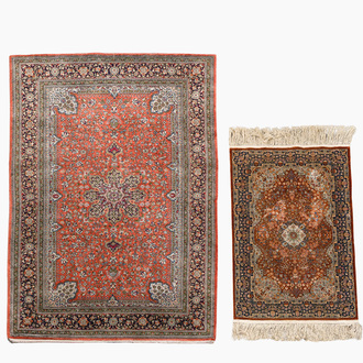 A Persian Qom (Qum/Ghom) silk rug and a Chinese silk Hereke style rug with floral design, 20th C.