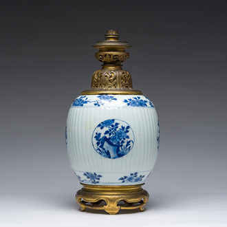 A Chinese blue and white vase with floral design with gilt bronze mounts mounted as a lamp, Kangxi