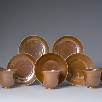 Five Chinese capucin brown ground cups and saucers with incised floral design, Qianlong