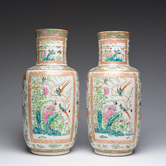 A pair of Chinese Canton famille rose vases with birds and butterflies among blossoming branches and antiques, 19th C.