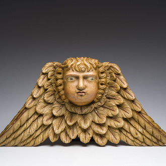 A presumably Central European carved and polychrome decorated oak head of an angel, 18th C.