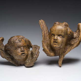 Two Flemish carved oak angel heads, 18th C.