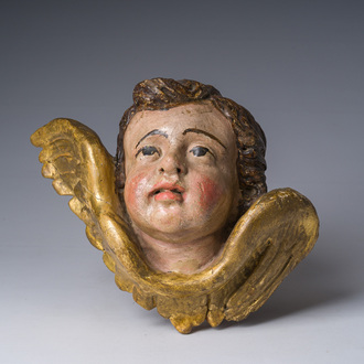 A gilt and polychrome decorated wooden angel's head, 18th C.