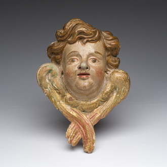 An Italian gilt and polychrome decorated wooden angel's head, 18th C.