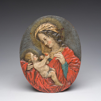 An oval polychromed wooden Virgin and Child relief, probably Tyrol, Austria, 18th C.