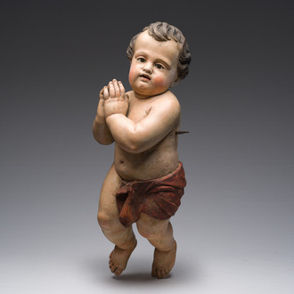 A Southern European carved and polychrome decorated figure of a praying angel, 19th C.