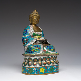 A Chinese cloisonné model of Buddha holding a white jade lotus flower, 20th C.