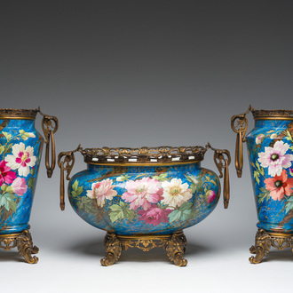 A French three-piece polychrome faience fine bronze mounted garniture with floral design, Creil Montereau Boulenger et Cie, 19th C.
