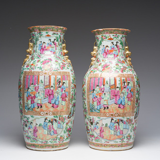 A pair of Chinese Canton famille rose vases with palace scenes and floral design, 19th C.