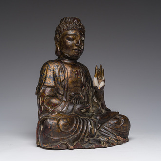 A Chinese gilt-lacquered and polychromed wooden Buddha, 17th/18th C.