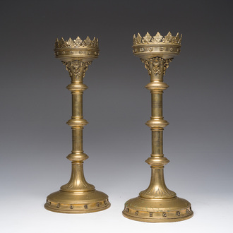A pair of brass partially engraved Gothic revival church candlesticks with floral relief design, ca. 1900