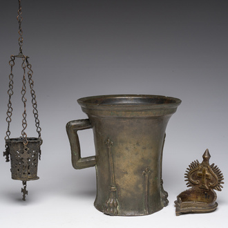 A presumably Nuremberg bronze mortar with lilies, a diya and a lamp holder, 15th C. and later