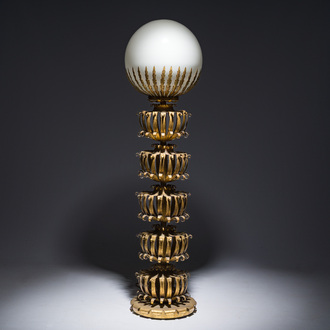 Maison Jansen (attr.): A gilt metal floor lamp crowned with a glowing globe, France, mid 20th C.