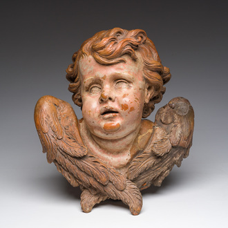 A polychromed terracotta cherub head, probably France, 18th/19th C.