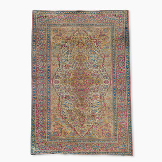 A Persian Kashan 'Mohtashem' silk rug with floral design, early 20th C.