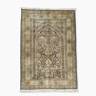 A Persian Qom (Qum/Ghom) silk rug with floral design and calligraphy, Mahneb, third quarter 20th C.