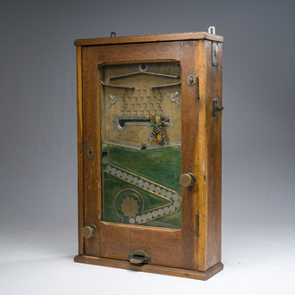 A German wooden 'Bajazzo' coin-operated gaming or slot machine with a harlequin, probably Jentzsch & Meerz, early 20th C.