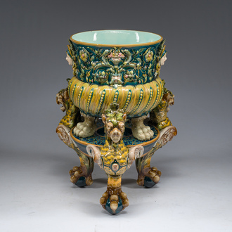A large Minton style maiolica jardinière on tripod pedestal with mascarons and griffins, 19th/20th C.