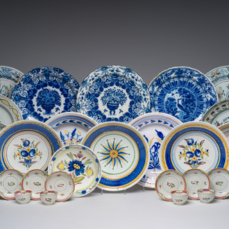 A varied collection of blue, white and polychrome Dutch Delft and Brussels faience dishes, together with four cups and six saucers, 18th/19th C.