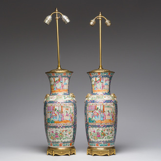 A pair of Chinese Canton blue-ground famille rose vases with palace scenes and floral design mounted into lamps, 19th C.