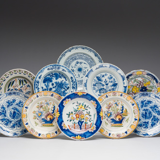 Twelve blue, white and polychrome Dutch Delft plates and dishes with floral design, 18th C.
