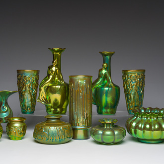 Eleven Hungarian Zsolnay Pecs eosin glazed vases and bowls with relief design, 20th C.