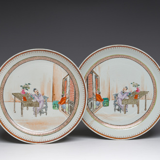 A pair of Chinese famille rose dishes with a scholar and his servant in an interior, Qianlong/Jiaqing