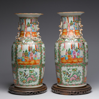 A pair of Chinese Canton famille rose vases with palace scenes and floral design, 19th C.